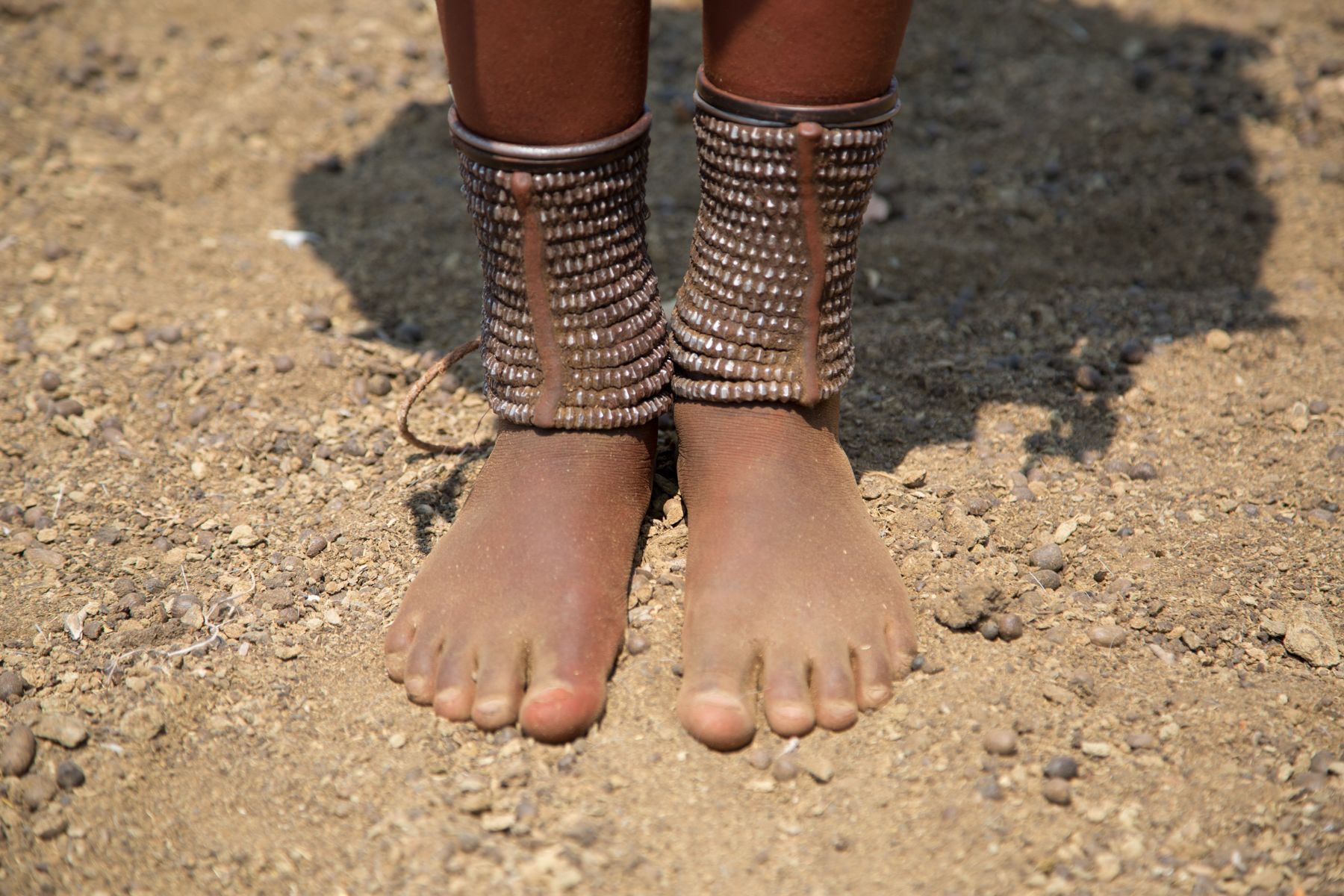 The feet of a Himba woman on our photo tour of Namibia