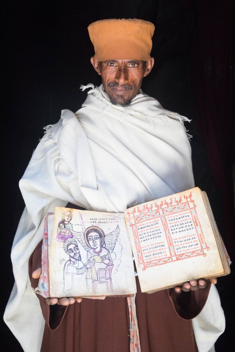 Aba Mezgebe, the father of the church at Asheten Maryam near Lalibela, reveals one of his church's ancient bibles