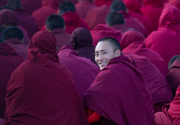 Smiling monks at a prayer session in Sexu or Sershul in remote Sichuan
