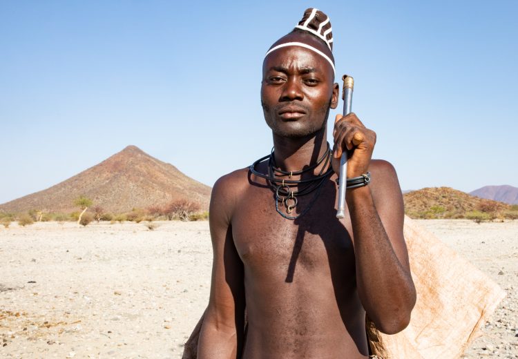 Tribe photography of the Muhimba people in Angola requires exploring the beautiful Yona National Park