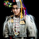 A pretty Brokpa girl wearing her ceremonial Tepi and cloaks