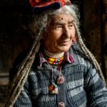Portrait of an elderly Brokpa lady in stunning light on our Zanskar photography tour