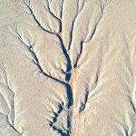 Deadvlei aerial detail shows ancient paths of water through the clay pan