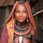Portrait of a beautiful Himba girl in remote Namibia on our photo tour