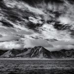 Clouds crown the peaks of Svalbard (image by Duncan Phillips)
