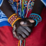 Beautiful hands of a Maasai girl. Maasai women are known for their intricate beading skills (image by Inger Vandyke)