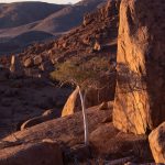 Watching the sun set over Damaraland from a mountain hideout