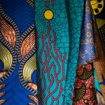 Colourful African fabrics adorn people and buildings all over West Africa