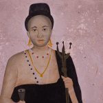 Street art depicts a woman wearing black, one of the key colours in Voodoo and representative of the night