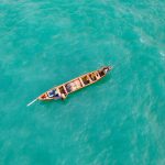 A beautiful pirogue anchored up off the coast of Grand Popo on our Benin photography tour