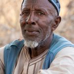 Portrait of a nomadic Fulani man in remote Benin on our Benin photo tour