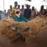 A wildly gyrating Guelede dancer at a ceremony on our Benin photography tour