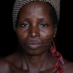 Holi women still adorn themselves with elaborate and beautiful scarification on our photography tour of Benin