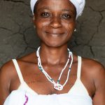 Portrait of Houèboussi, a Fon dancer dressed in white to celebrate the initiation of three small girls in a remote village near the border of Benin and Togo