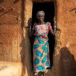 Portrait of Margarita emerging from her beautiful Otamari tata in northern Benin