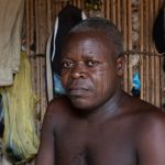Portrait of Odu, a heavily scarred Holi man on our Benin photography tour