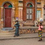 Explore street photography around the colourful mosque of Porto Novo on our Benin photography tour