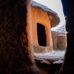 Looking from the inside of an Otamari tata (house) towards the sleeping area and granaries on the roof