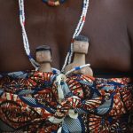 Twins who have died at birth are honoured by dolls created for them and that are carried about by their parents for as long as their parents live