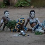 Voodoo princesses take a break from dancing at an initiation ceremony during the Wild Images photography tour of Benin