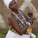 Portrait of a Beninese woman dancing Zandro, the ceremony to celebrate the offering of animals to the Voodoo spirits
