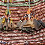 Dried goats hooves act as bells and decorations on a Nyadol traditional skirt of Toposa women