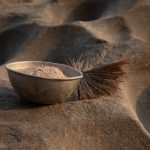 On our photography tour of South Sudan we visit traditional grinding pits used to make flour from millet