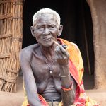 An elderly Laarim women with her traditional pipe