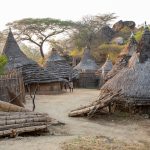 A typical Laarim village nestled in the boulders of the Kimotong mountains