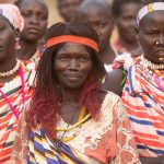 A lead woman dancer of Laarim girls dancing a Nakeku in their village