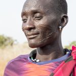Portrait of Elia, a traditional Toposa man with his facial scarification