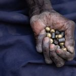 Runes held in the ancient hand of Yolanda, a Lotuko witch
