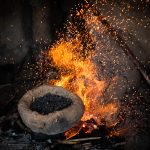 Sparks fly at the workshop of a Senufo blacksmith on our Ivory Coast photo tour