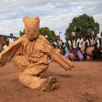 A young Senufo boy dances the Boloye Panther Dance at Korhogo