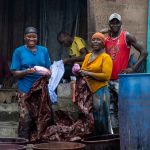 Textile workers outside Abidjan on our photo tour of Ivory Coast