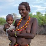 Portrait of a Dassanech woman and her baby on our Lake Turkana photo tour