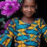 Portrait of a pretty Fulani girl at her home