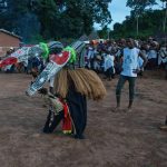 Dusk performance of stilt dancer at Godufu on our Ivory Coast photo tour