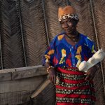 A proud grandmother at N'Zima fishing village in the French Quarter of Grand Bassam