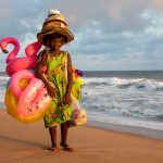 Meet colourful souvenir sellers on the beach at Grand Bassam during our photo tour of Ivory Coast (Côte D'Ivoire)