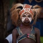 A young Guéré girl waits her turn in the Dance of the Jugglers
