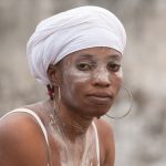 A Komian takes a moment to rest between dances
