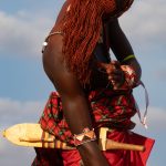 Samburu man playing with his hair on our Lake Turkana photo tour