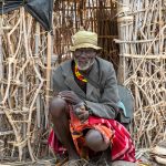 An elderly Turkana man outside his home on our Lake Turkana photo tour