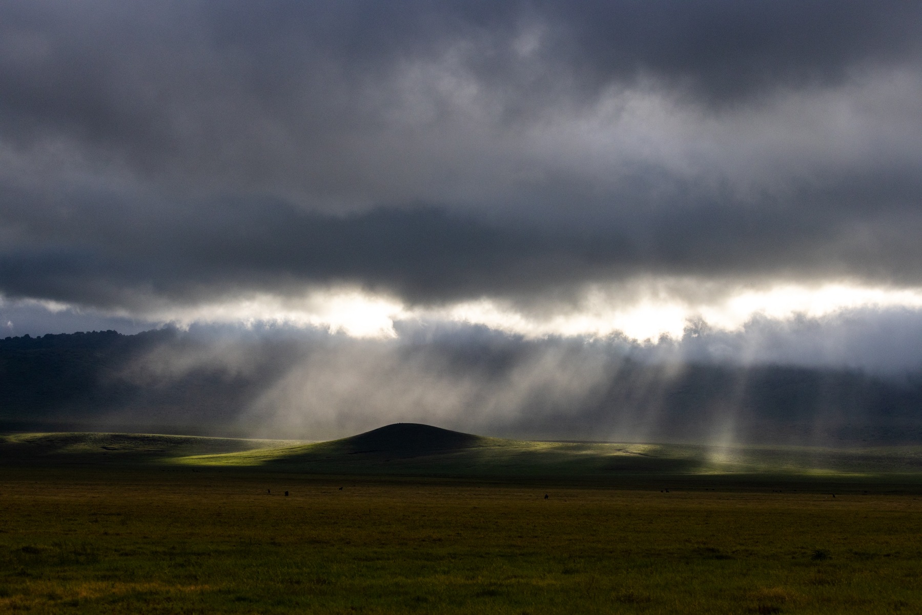 Rays of light illuminate the crater floor at Ngorongoro