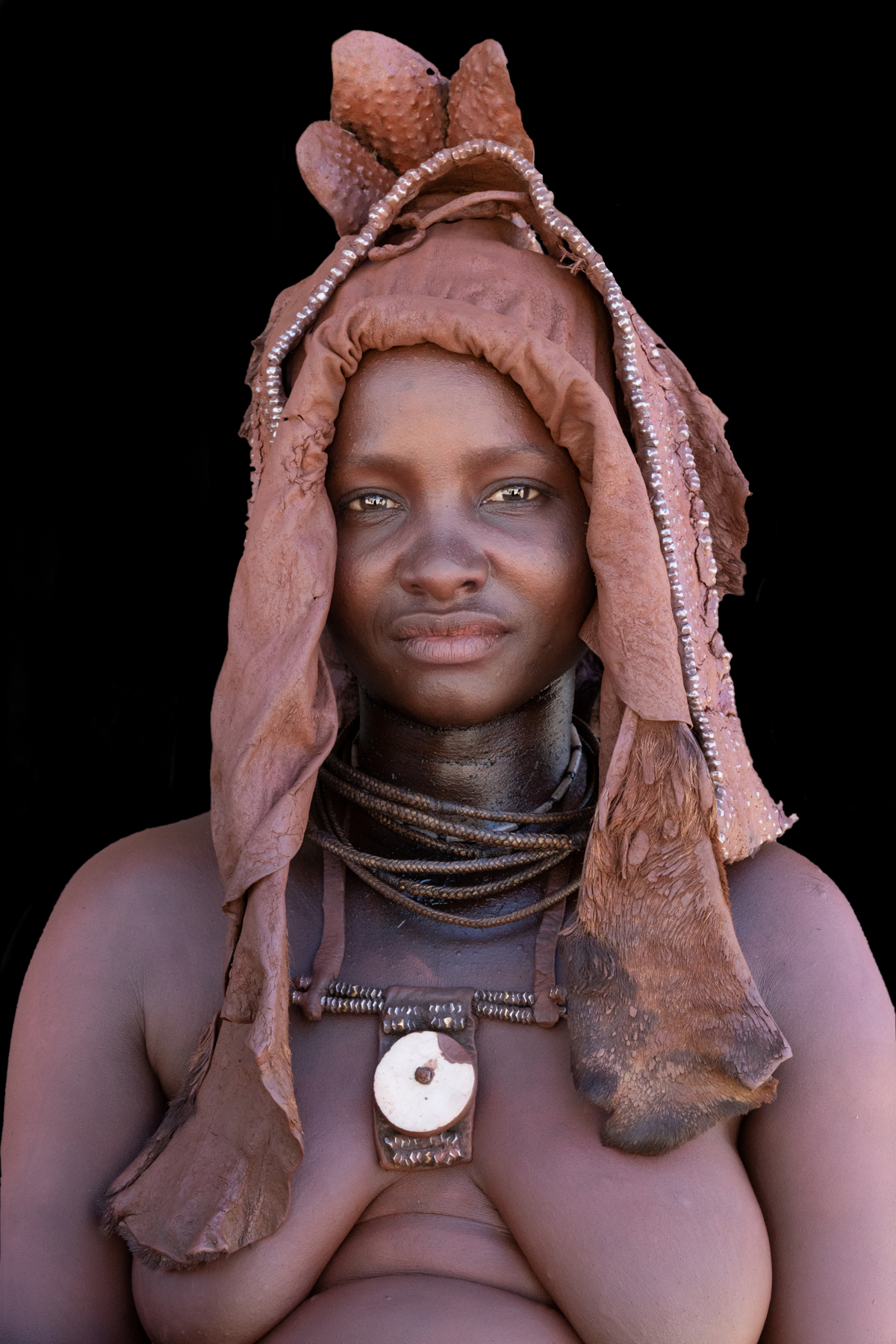 Portrait of a Ovahimba lady wearing a traditional wedding crown of Ekoli
