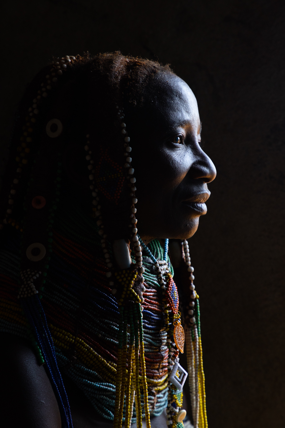 Low light portrait of a Ovamwila lady in Angola