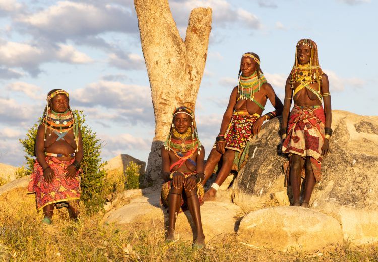 Sunset photography with a fantastic group of Ovamwila women during our tribal photography tour of Angola