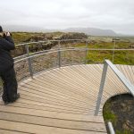 Chantal using modern facilities to find an angle at an ancient location, Þingvellir (image by Mike Watson)