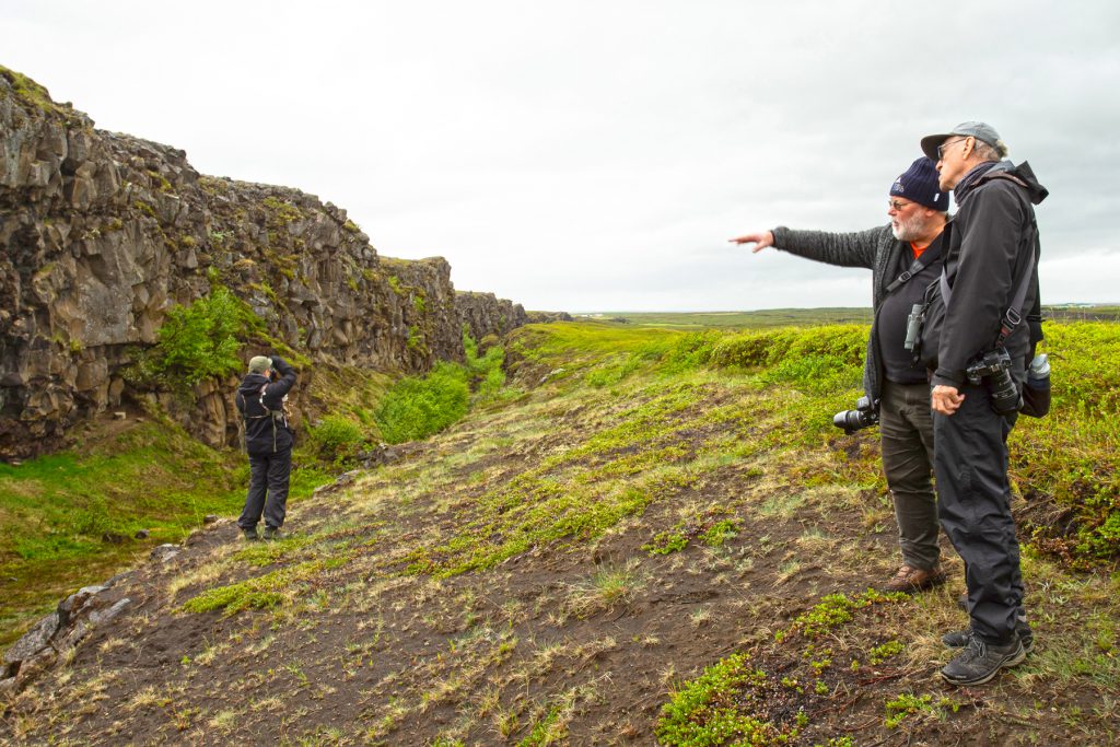 Our guest geologist Ian gives a free lesson at the mid-Atlantic Ridge at Asbjyergi in northeast Iceland (image by Mike Watson)